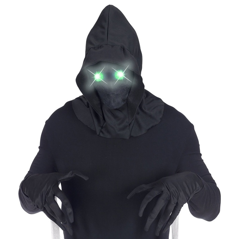 Faceless mask with green eyes