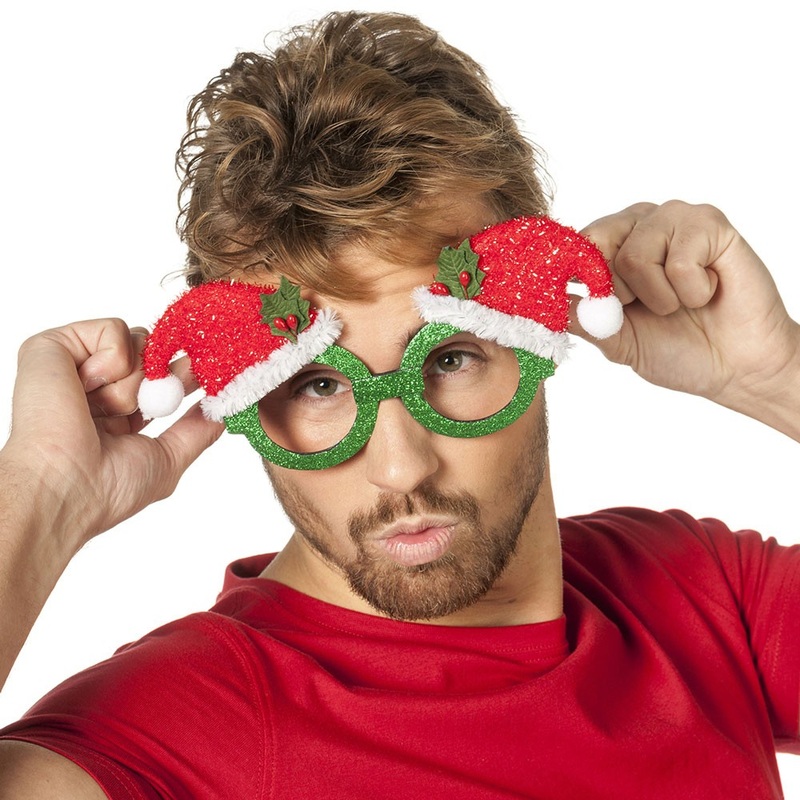Glittering party glasses with Christmas hats